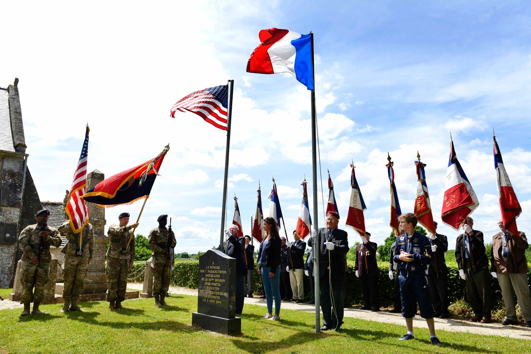 The U.S. and French flags are raised during the 507th Parachute Infantry Regiment cemetery stone ceremony in Hémevez, France, June 3, 2017. Air Force photo by Airman 1st Class Alexis C. Schultz