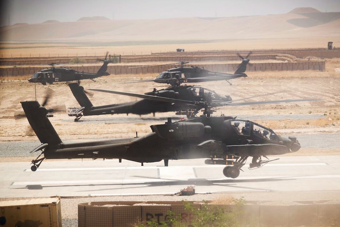 Army AH-64E Apache helicopter pilots prepare to depart for a mission in Kunduz, Afghanistan, May 31, 2017. Army photo by Capt. Brian Harris         