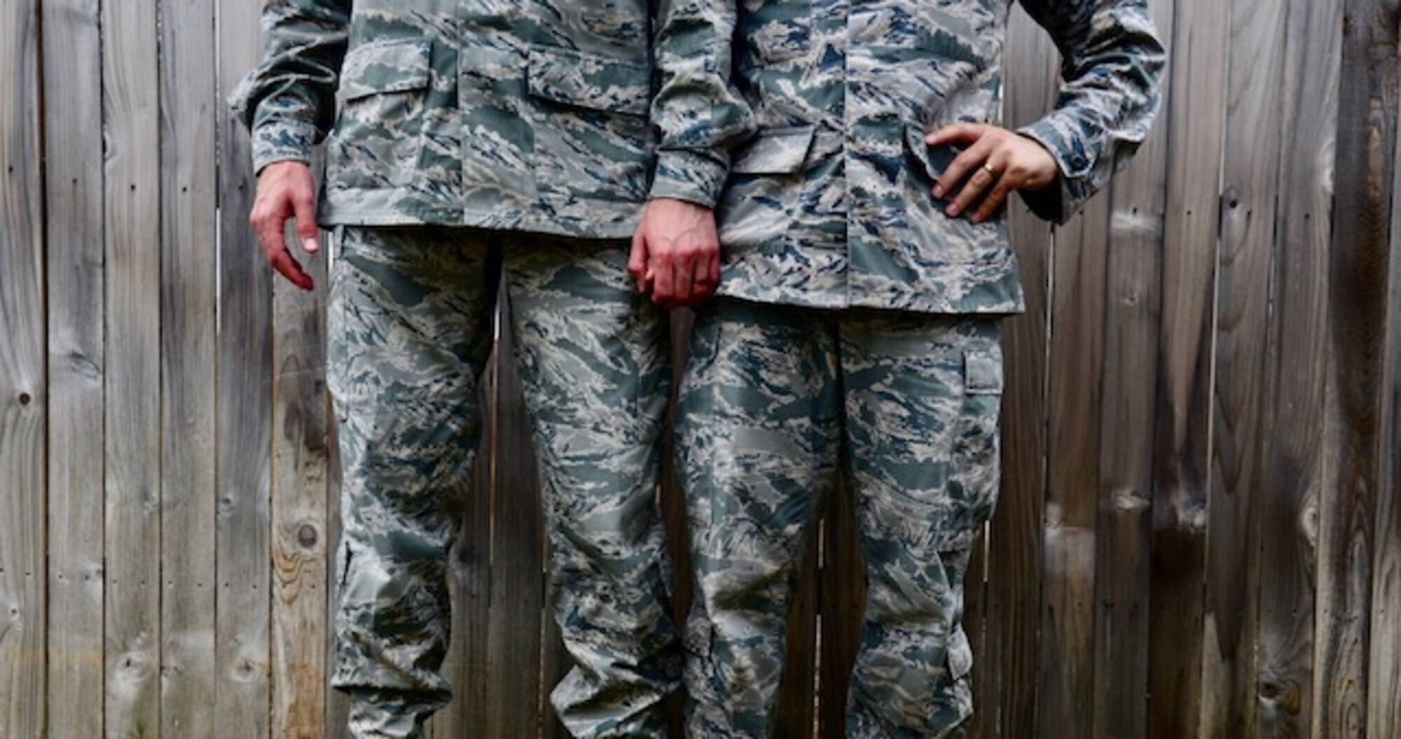 U.S. Air Force Staff Sgts. Alexx and Chip Pons, who serve separate commands as photojournalists at Joint Base San Antonio, Randolph, Texas, stand united as a married, dual-military, same sex couple. Since the repeal of Don’t Ask, Don’t Tell in 2011 and the legalization of same-sex marriage in 2015, the two have been able to serve openly with the support of their Air Force family. (U.S. Air Force photo by Staff Sgt. Alexx Pons)