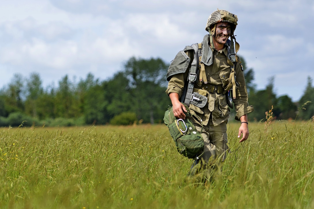 A paratrooper participates in an airborne operation in Sainte-Mere-Eglise, France, June 4, 2017. The airborne operation commemorates the 73rd anniversary of D-Day, the largest multi-national amphibious landing and operational military airdrop in history, and highlights the U.S. commitment to European allies and partners. Air Force photo by Airman 1st Class Alexis C. Schultz
