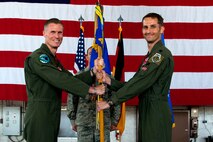 U.S. Air Force Col. Michael Thompson, 52nd Operations Group commander, left, gives the ceremonial guidon to U.S. Air Force Lt. Col. Mike Richard, incoming 480th Fighter Squadron commander, during the 480th FS change of command ceremony on Spangdahlem Air Base, Germany, June 2, 2017. (U.S. Air Force photo by Airman 1st Class Preston Cherry)