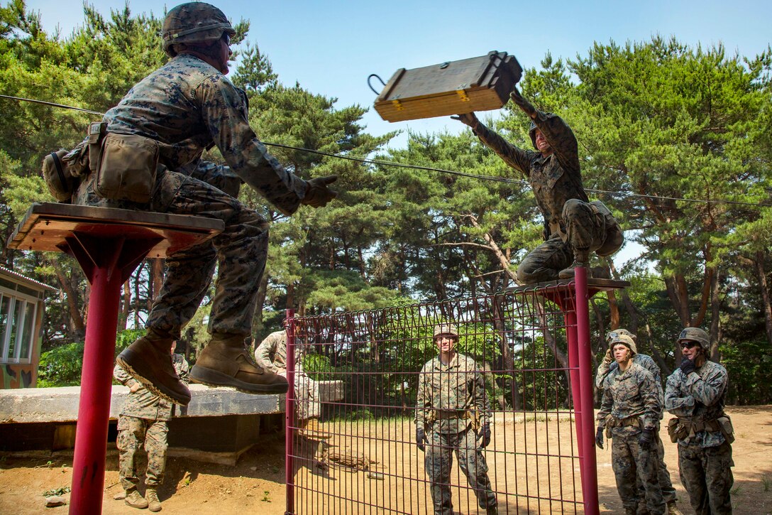 Marines and sailors participate in a small unit leadership building course at Camp Mujuk, South Korea, May 29, 2017. The Marines and sailors are assigned to India Company, 3rd Battalion, 8th Marine Regiment. The course helps build confidence and communication skills within units. Marine Corps photo by Lance Cpl. Caleb T. Maher