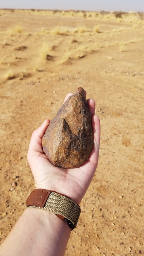 A complete hand axe in the discovered assortment of axes dated to over 1 million years ago, likely hewn by Homo erectus. The objects were likely brought to this specific site during seasonal flooding.