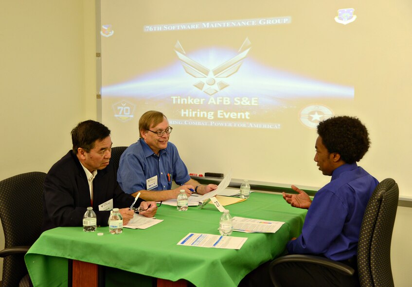 Chinh Nguyen, left, with the 558th Software Maintenance Squadron, and David Walton, with the 557th SMXS, discuss the resume and skills of a prospective hire during the 76th Software Maintenance Group’s recent hiring event. The 76th SMXG is still hiring for engineering positions as well as computer science degree holders and entry-level and experienced professionals. (Air Force photo by Kelly White)