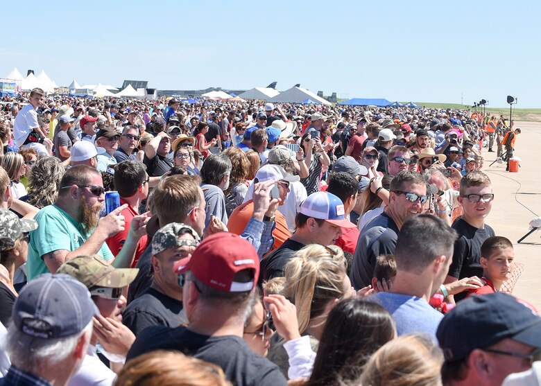 A record setting crowd of over 100,000 gathered to watch the U.S. Air Force Thunderbirds May 20 during the Star Spangled Salute Air Show at Tinker Air Force Base, Okla. There were more than 60,000 in attendance May 21. For the first time in Tinker air show history, officials closed the incoming gates to visitors after reaching parking capacity. The year 2017 marks the 75th anniversary of Tinker AFB, the 45th anniversary of the 507th Air Refueling Wing and the 40th anniversary of the E-3 Sentry at Tinker AFB.  (Air Force photo by Mark Hybers)