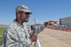 Col. Kenyon Bell, 72nd Air Base commander, emphasizes the importance of community support to the base while giving opening remarks during Tinker Air Force Base's Star Spangled Salute air show May 21, 2017, Tinker Air Force Base, Oklahoma. Col. Bell addressed the record-breaking crowd from the raised announcers booth at air show center. (U.S. Air Force photo/Greg L. Davis)