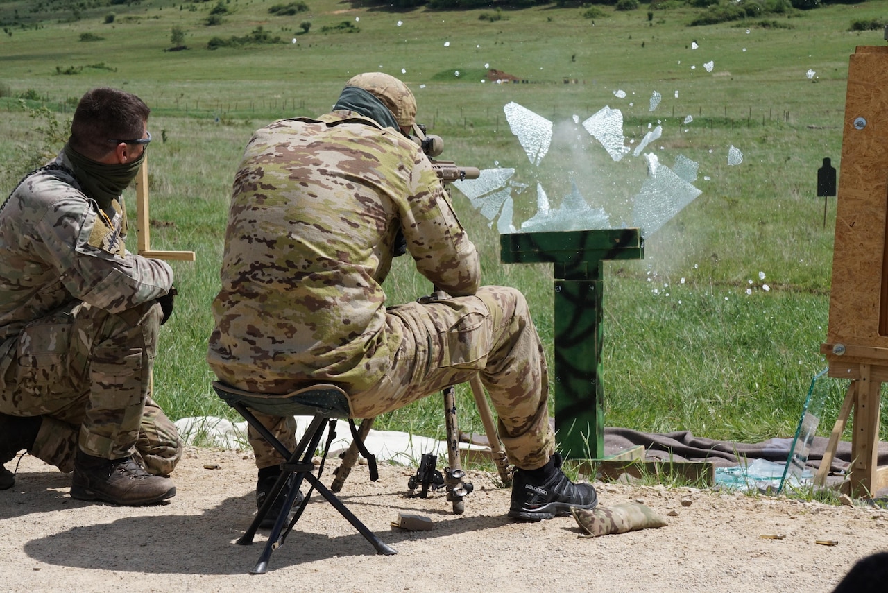 HOHENFELS, Germany -- Snipers engage 100m targets through glass panels on the first live-fire day of Urban Sniper Course May 20. Approximately 20 international special forces Soldiers participated in the International Sniper Training Course instructed at the Joint Multinational Readiness Center's Training Area May 20. The course of instruction and team competitions commenced on May 19 and complete May 30. (U.S. Army photo by Sgt. Karen Sampson)