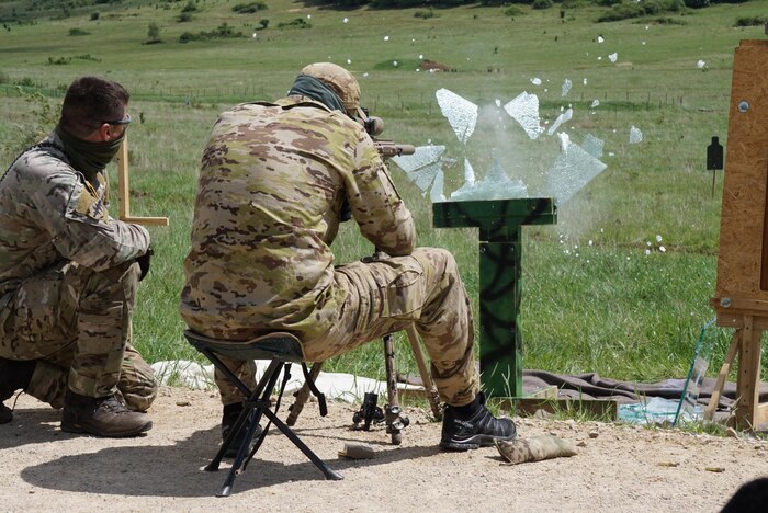 HOHENFELS, Germany -- Snipers engage 100m targets through glass panels on the first live-fire day of Urban Sniper Course May 20. Approximately 20 international special forces Soldiers participated in the International Sniper Training Course instructed at the Joint Multinational Readiness Center's Training Area May 20. The course of instruction and team competitions commenced on May 19 and complete May 30. (U.S. Army photo by Sgt. Karen Sampson)