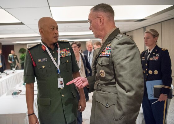 Marine Corps Gen. Joe Dunford, right, chairman of the Joint Chiefs of Staff, meets with Malaysian Chief of Defense Gen. Raja Mohamed Affandi Raja Mohamed Noor during a bilateral session at the Shangri-La Dialogue security conference in Singapore, June 4, 2017. 