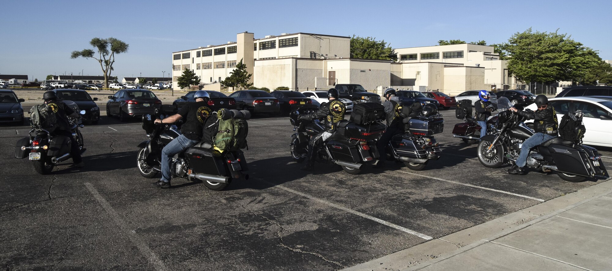 Members of the Combat Veterans Motorcycle Association park their bikes in front of the Thunderbird Inn dining facility on Kirtland Air Force Base, May 30, 2017. The veterans spoke with Team Kirtland airmen about suicide prevention and having each other’s backs in all situations. (U.S. Air Force Photo/Senior Airman Chandler Baker)