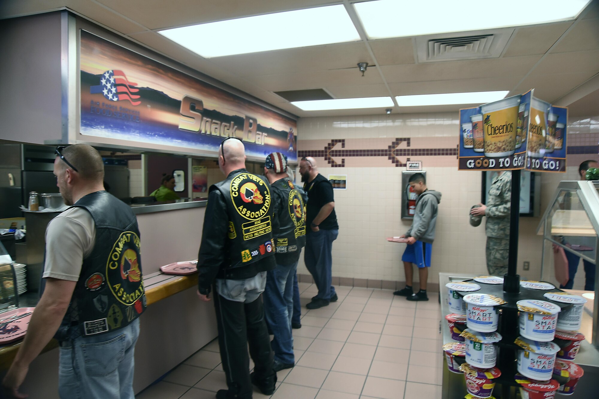 Members of the Combat Veterans Motorcycle Association stand in line inside the Thunderbird Inn dining facility at Kirtland Air Force Base, May 30, 2017. The veterans spoke with Team Kirtland airmen about suicide prevention and having each other’s backs in all situations. (U.S. Air Force Photo/Senior Airman Chandler Baker) 