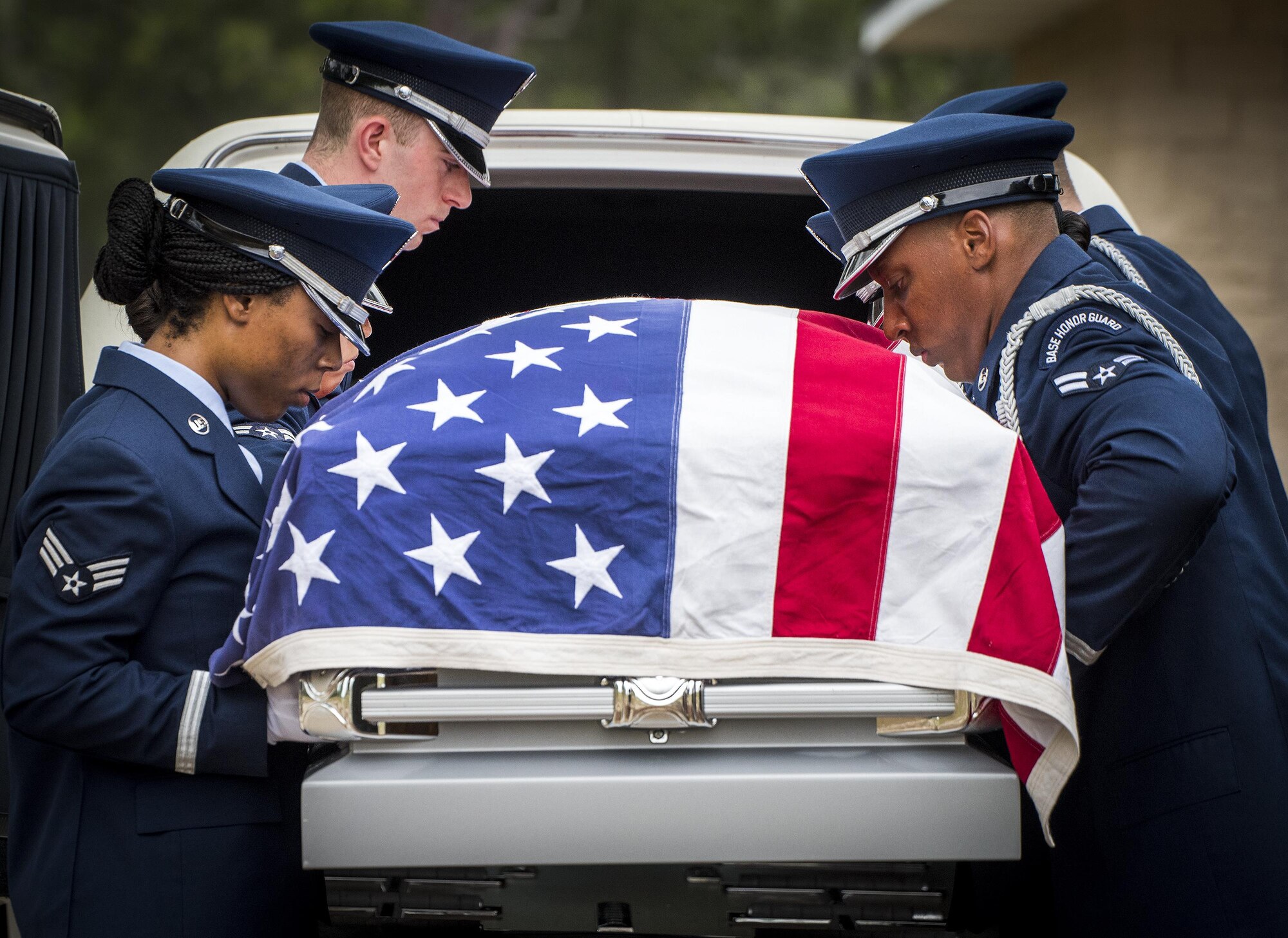 Honor Guard Airmen carry a casket out of a hearse during the unit’s graduation ceremony at Eglin Air Force Base, Fla., June 1. Approximately 12 new Airmen graduated from the 120-plus-hour course. The graduation performance includes flag detail, rifle volley, pall bearers and bugler for friends, family and unit commanders. (U.S. Air Force photo/Samuel King Jr.)