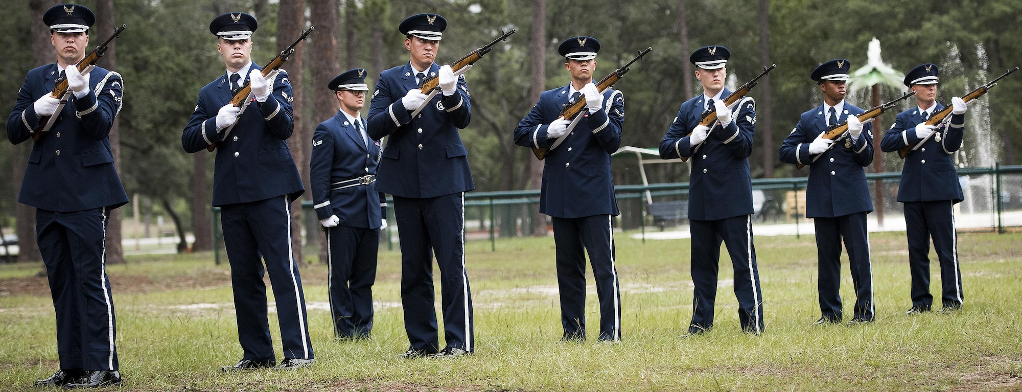 New Honor Guard members perform a rifle volley at the unit’s graduation ceremony at Eglin Air Force Base, Fla., June 1. Approximately 12 new Airmen graduated from the 120-plus-hour course. The graduation performance includes flag detail, rifle volley, pall bearers and bugler for friends, family and unit commanders. (U.S. Air Force photo/Samuel King Jr.)