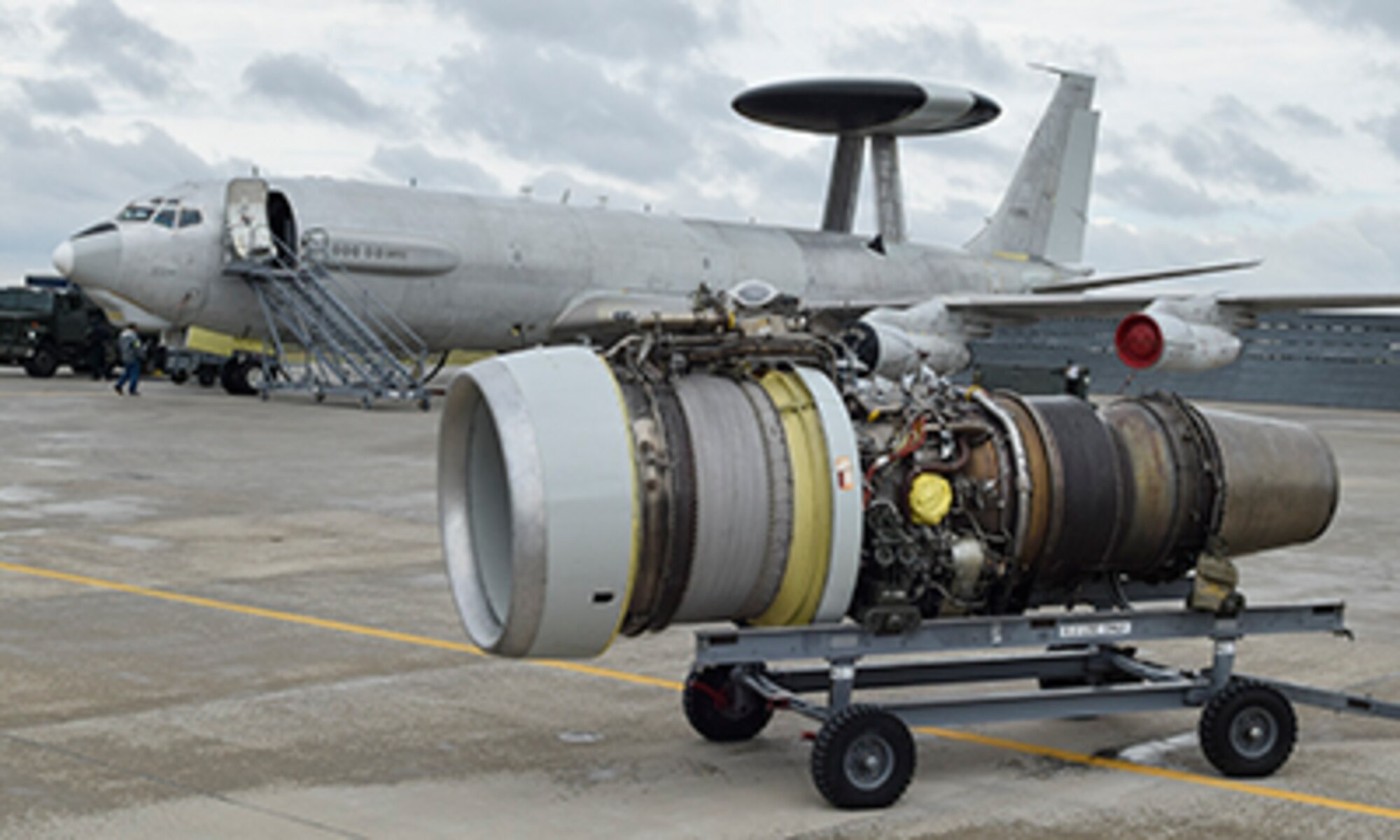 A Pratt & Whitney TF33 engine sits on a transport cart at the Oklahoma city Air Logistics Complex May 23, 2017, Tinker Air Force Base, Oklahoma. The TF33 shown is the type which powers the E-3 Airborne Warning and Control System and is one of the oldest engine families in the U.S. Air Force inventory. (U.S. Air Force photo/Greg L. Davis)