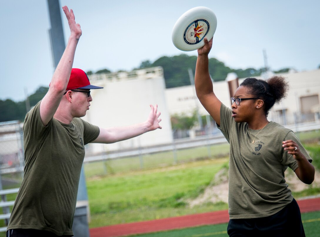 A player looks to pass during an Ultimate Frisbee game that was part of the Eglin Connects event at Eglin Air Force Base, Fla., June 2.  The event to help promote resiliency featured information booths, sporting events and a car show.  (U.S. Air Force photo/Samuel King Jr.)