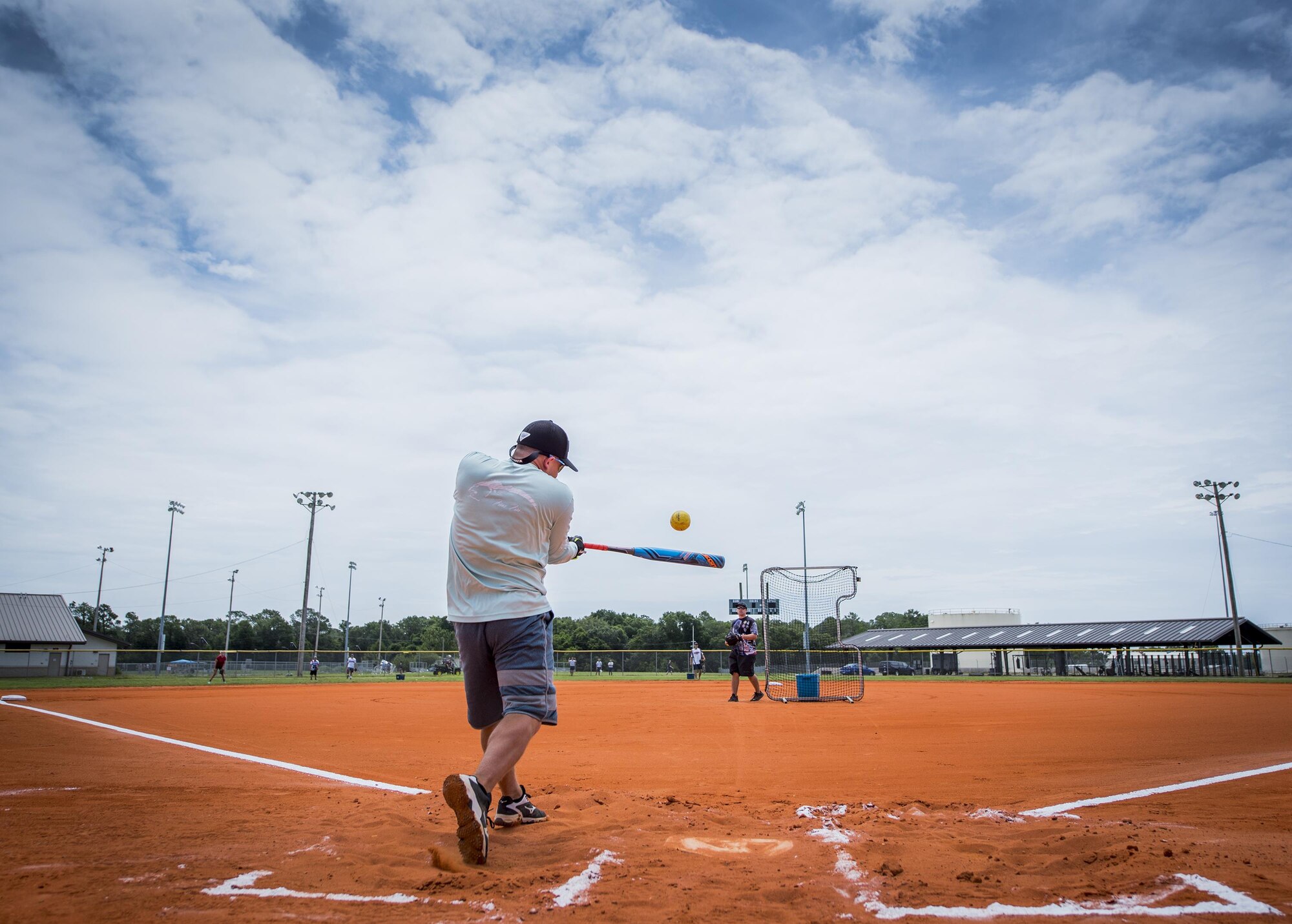 An Airman swings for the fences at the Homerun Derby game that was part of the Eglin Connects event at Eglin Air Force Base, Fla., June 2.  The event to help promote resiliency featured information booths, sporting events and a car show.  (U.S. Air Force photo/Samuel King Jr.)