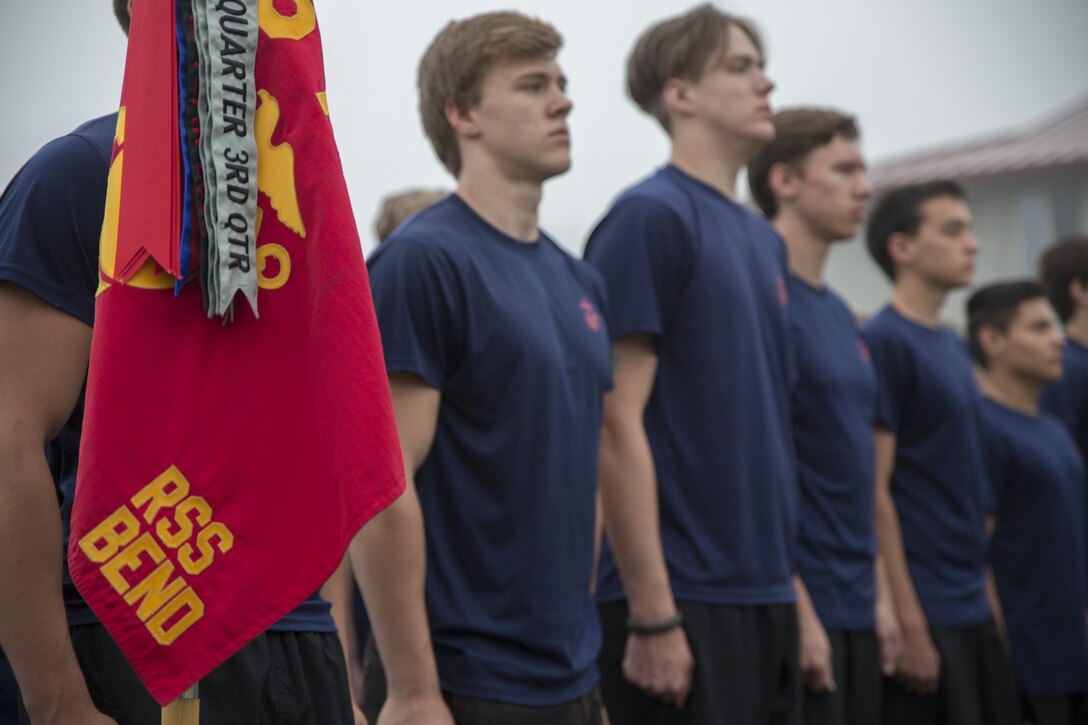 Poolees with RSS Bend stand in formation while receiving direction from their drill instructor. Poolees within RS Portland gathered at Camp Rilea, Warrenton, Oregon, for an annual 3-day field meet. Poolees were given an opportunity to experience aspects of recruit training to include drill instructors, and physical training. (U.S. Marine Corps Photo by Sgt. Taylor Morton/Released) 