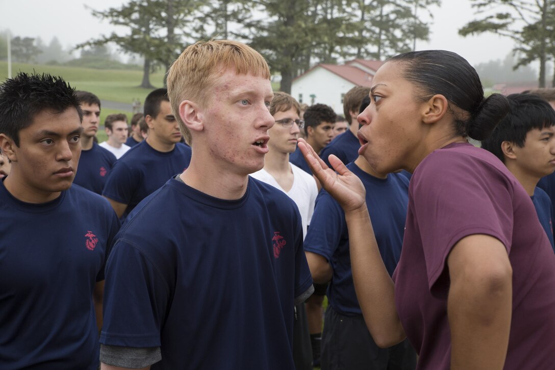 Drill Instructor Sgt. Brittany Barbier, Papa Company, MCRD Parris Island, encourages a Poolee at the RS Portland Annual Pool Function. Poolees within RS Portland gathered at Camp Rilea, Warrenton, Oregon, for an annual 3-day field meet. Poolees were given an opportunity to experience aspects of recruit training to include drill instructors, and physical training. (U.S. Marine Corps Photo by Sgt. Taylor Morton/Released) 
