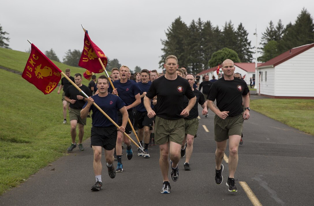 Commanding Officer, Maj. Brooks Boehlert and Sergeant Major, Sgt. Maj. Mark Wright lead the motivational run at the RS Portland Annual Pool Function. Poolees within RS Portland gathered at Camp Rilea, Warrenton, Oregon, for an annual 3-day field meet. Poolees were given an opportunity to experience aspects of recruit training to include drill instructors, and physical training. (U.S. Marine Corps Photo by Sgt. Taylor Morton/Released) 