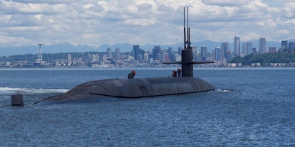 The Ohio-class ballistic-missile submarine USS Nebraska (SSBN 739) passes by Seattle during sea trials June 02, 2017, after completing an extended major maintenance period, to include an engineered refueling overhaul at Puget Sound Naval Shipyard and Intermediate Maintenance Facility (PSNS & IMF). (U.S. Navy photo by Culinary Specialist Seaman Joseph W. Weiser/Released)
