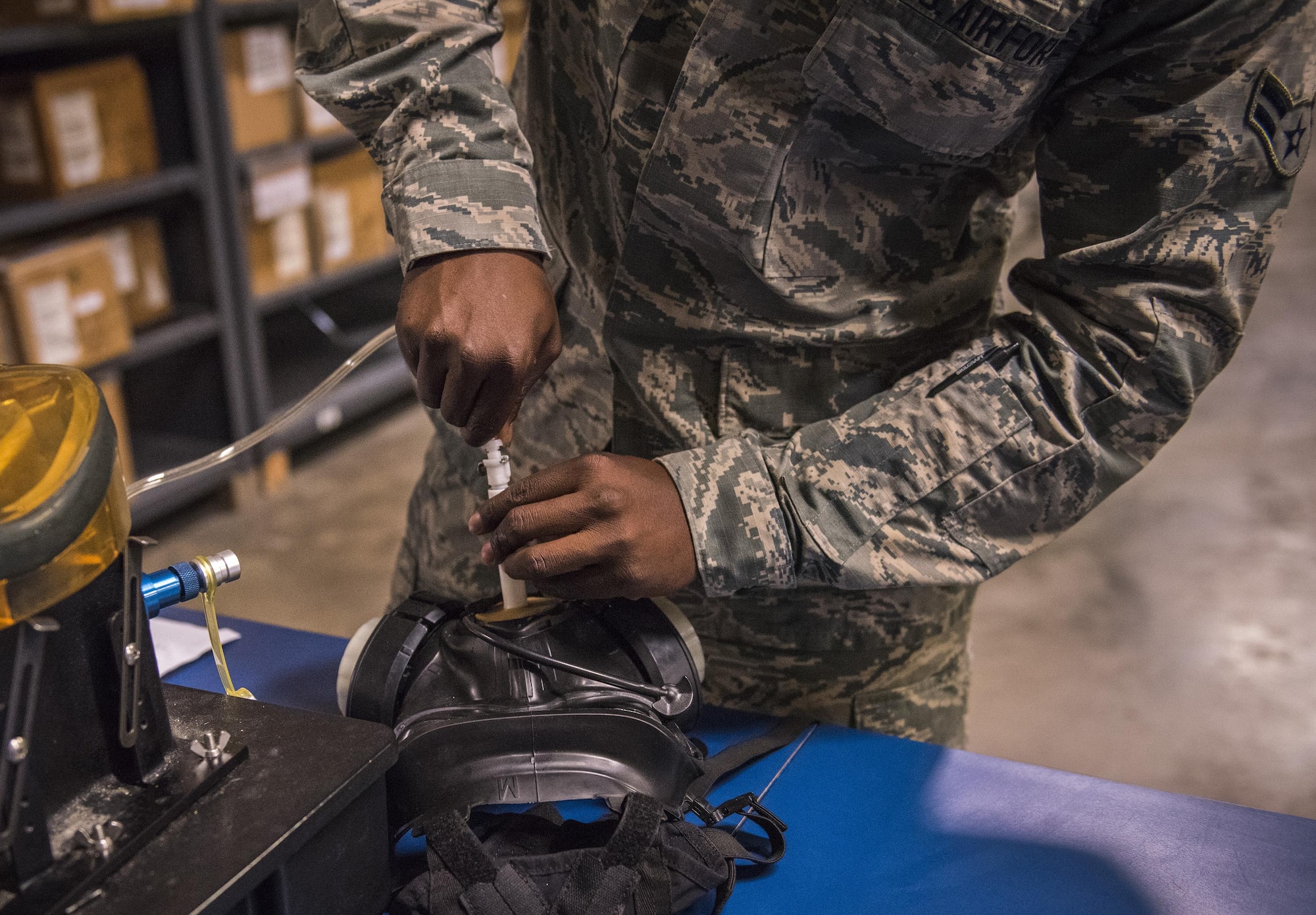 Gas mask fit testing is performed by the 96th Logistics Readiness Squadron's individual protective equipment section.  (U.S. Air Force photo/Ilka Cole)