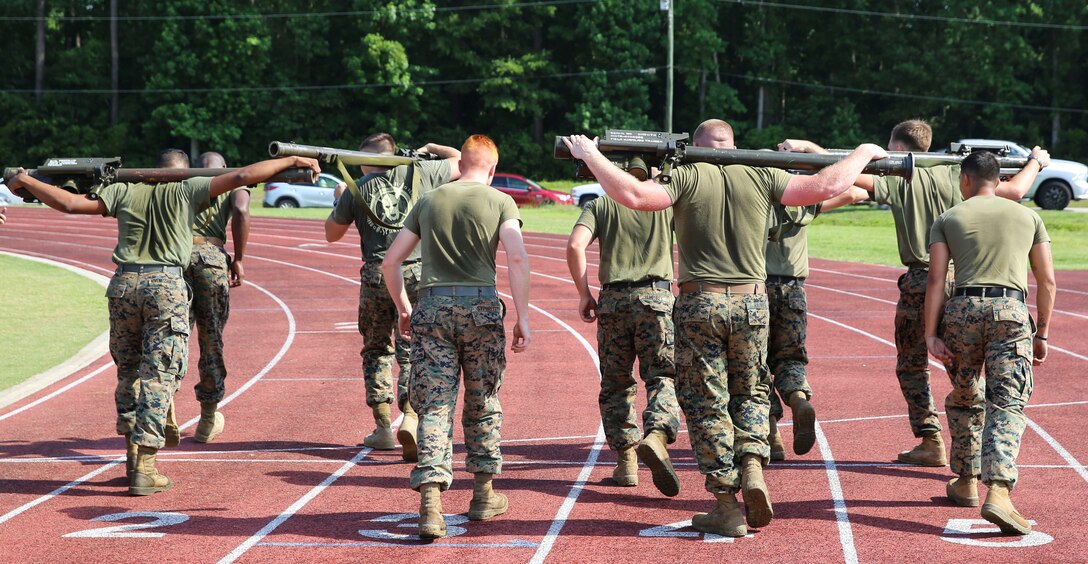 Marines prepare for the stinger missile race during a combine hosted by Marine Air Control Group 28 at Marine Corps Air Station Cherry Point, N.C., June 2, 2017. During the race, two people from each team ran with a stinger missile for one mile. While running, the Marines were able to pass the missile back and forth to their partner. Each squadron within MACG-28 had teams of 20 Marines competing in multiple events including a relay race, javelin throw, and Humvee push. (U.S. Marine Corps photo by Lance Cpl. Cody Lemons/Released) 