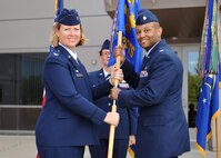 Col. DeAnna Burt, 50th Space Wing commander, welcomes Maj. Stephen Cash to command during the 50th Somptroller Squadron change of command cerremony at Schriever Air Force Base, Colorado, Friday, June 2, 2017. Cash assumed command from 
 Maj. Latoya Smith. (U.S. Air Force Photo/Dennis Rogers)