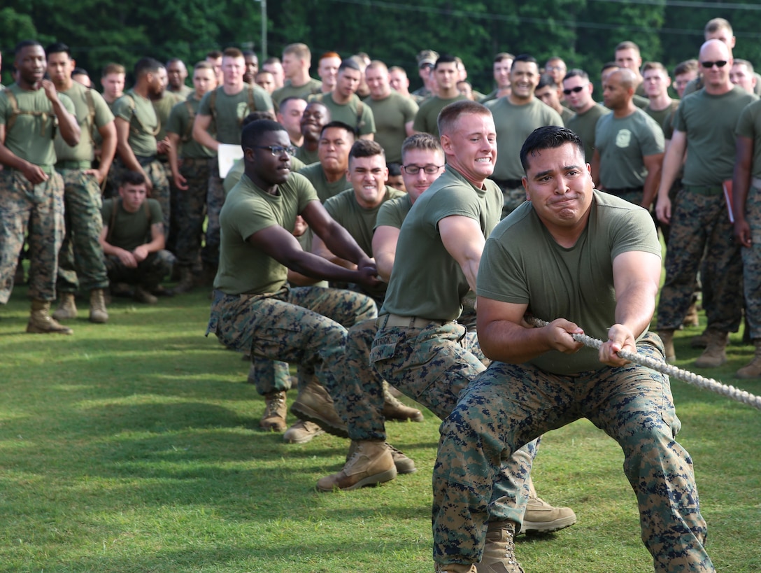 Marines assigned to Marine Air Support Squadron 1 give it their all during a tug-of-war competition as part of an athletic combine at Marine Corps Air Station Cherry Point, N.C., June 2, 2017. The combine featured teams from each squadron within Marine Aircraft Group 28. The combine consisted of different physical competitions such as a relay race, Humvee push and a javelin throw. MASS-1 reigned victorious over the tug-of-war competition. (U.S. Marine Corps photo by Lance Cpl. Cody Lemons/Released)