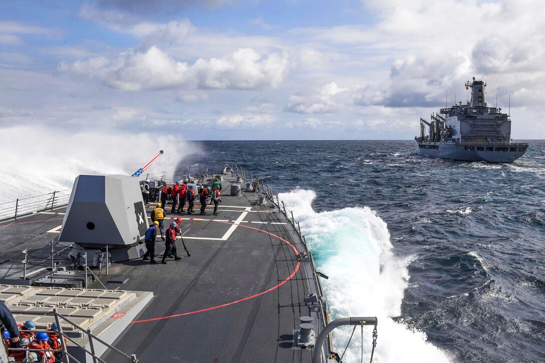 A wave breaks on the forecastle of the Arleigh Burke-class guided-missile destroyer USS Wayne E. Meyer as the ship begins the approach to fleet replenishment oiler USNS Rappahannock for a replenishment in the Pacific Ocean, May 26, 2017. Navy photo by Petty Officer 3rd Class Kelsey L. Adams 