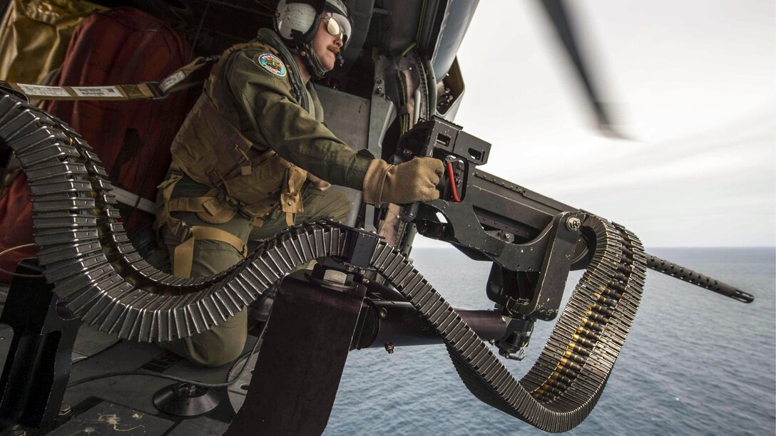 Navy Petty Officer 2nd Class Nicholas Lovelace prepares to shoot a target with a .50-caliber machine gun during a gunnery exercise with the Royal Thai Navy in the Gulf of Thailand, June 3, 2017, as part of Cooperation Afloat Readiness and Training Thailand. 
The annual exercise seeks to strengthen relationships and enhance force readiness. Navy photo by Petty Officer 3rd Class Deven Leigh Ellis
