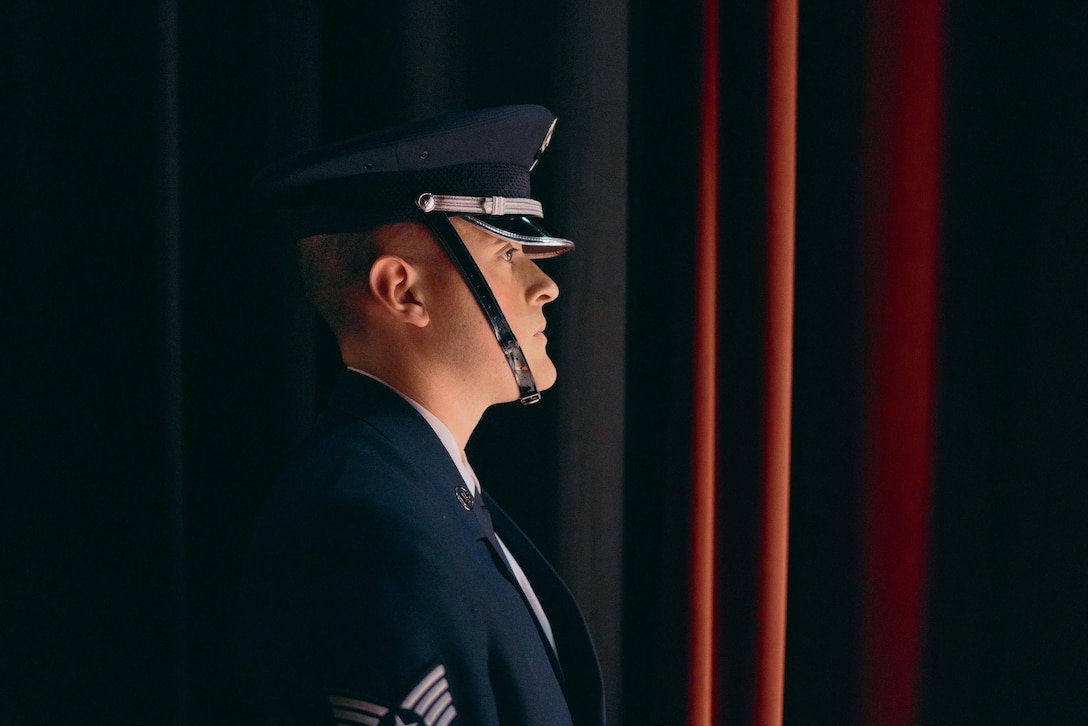 Staff Sgt. Scott Zawacki, U.S. Air Force Honor Guardsman, prepares to post the colors during an U.S. Air Force Band Airmen of Note performance at The Classic Center Theatre in Athens, Ga., May 24, 2017. Both the band and the honor guard share the same mission: to honor those who have served, inspire patriotism and service, and positively impact the global community on behalf of the U.S. Air Force and the United States of America. (U.S. Air Force photo by Senior Airman Delano Scott)