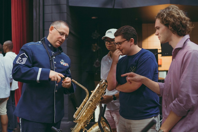 Master Sgt. Douglas Morgan, U.S. Air Force Band’s Airmen of Note trombonist baritone saxophonist, shares details about his instrument with audience members after a performance at the Davidson Fine Arts School Theatre in Augusta, Ga., May 25, 2017. The Airmen of Note’s mission is to honor those who have served, inspire American to heightened patriotism and service, and positively impact the global community on behalf of the Air Force. (U.S. Air Force photo by Senior Airman Delano Scott)