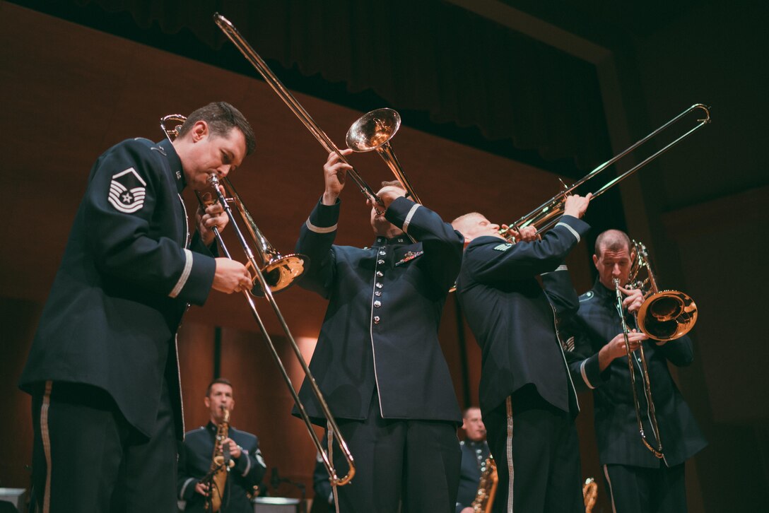U.S. Air Force Band’s Airmen of Note trombonists perform a song at the Fine Arts Auditorium in Savannah, Ga., May 26, 2017. The band played a variety of contemporary jazz pieces throughout each performance, all having a distinctive tie to the armed forces. Each piece of music was written, arranged or performed by service members. (U.S. Air Force photo by Senior Airman Delano Scott)