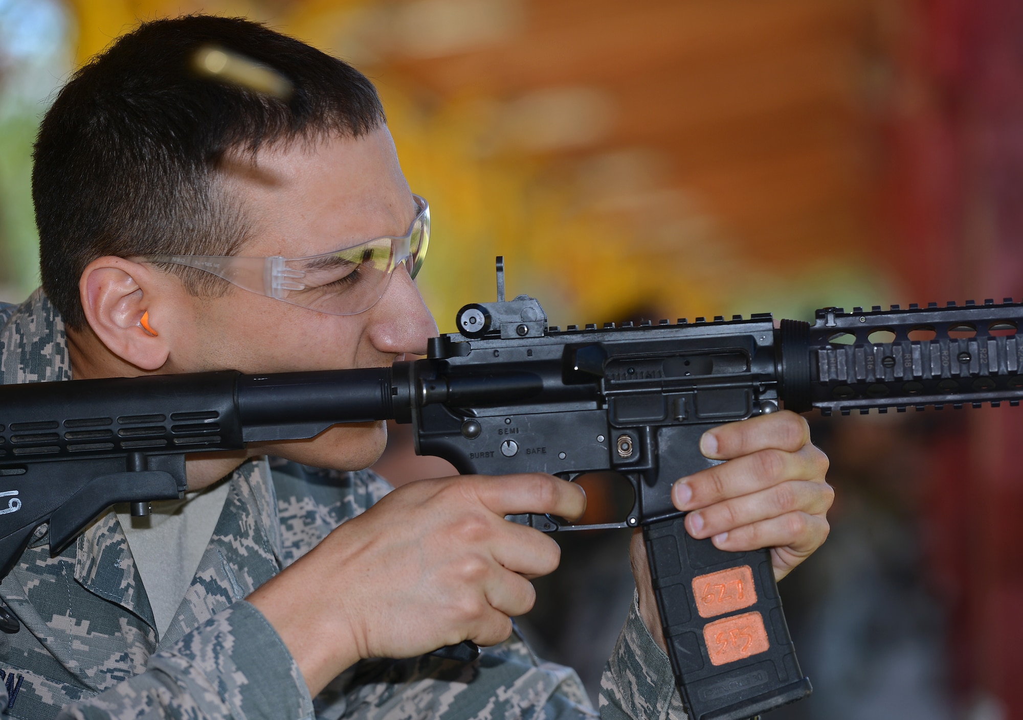 Staff Sergeant Bryan Wilson, 116th Weather Flight weather forecaster, fires an M-4 Carbine rifle from a kneeling position during the Elementary Level Rifle Excellence Competition May 31, 2017, at Joint Base Lewis-McChord, Wash. Competitors shot from four different positions providing shooters the opportunity to score a maximum of 500 points. (U.S. Air Force photo/Senior Airman Jacob Jimenez)  