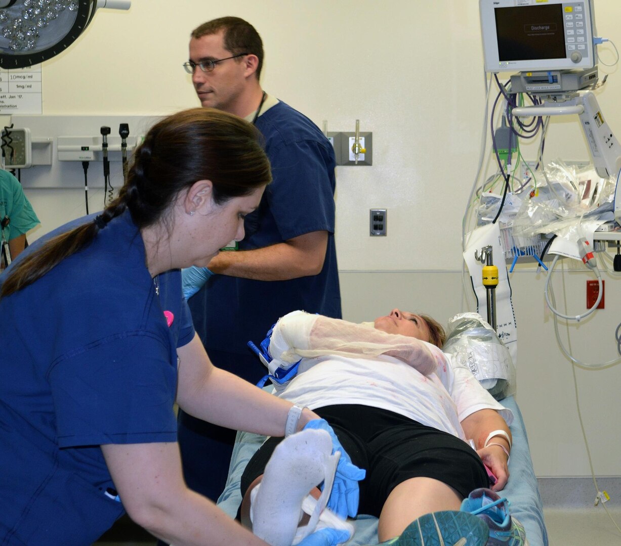 Medical personnel assess the injuries of a simulated casualty May 31 as part of a no-notice mass casualty exercise at Brooke Army Medical Center. The exercise was a collaborative effort between BAMC and Schertz emergency medical services, fire and police departments. 