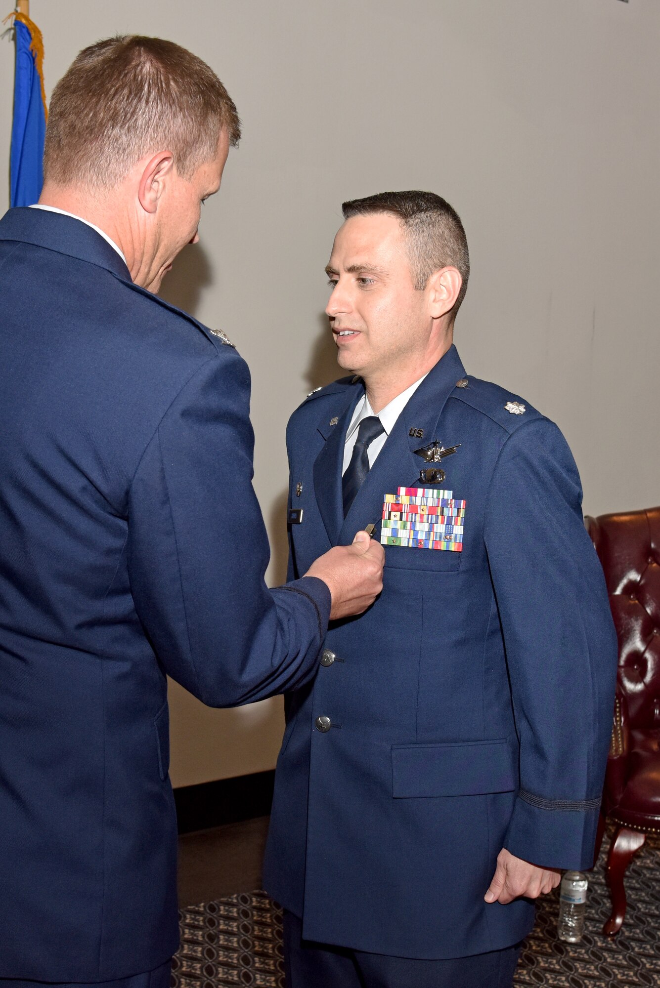 U.S. Air Force Lt. Col. Edward Harris, 17th Comptroller Squadron Commander, stands at attention as Col. Jeffery Sorrell, 17th Training Wing Vice Commander, pins on a Meritorious Service medal during the 17th CPTS Change of Command ceremony at the Event Center on Goodfellow Air Force Base, Texas, June 2, 2017. Harris received the medal for outstanding service to the wing. (U.S. Air Force photo by Staff Sgt. Joshua Edwards/Released)