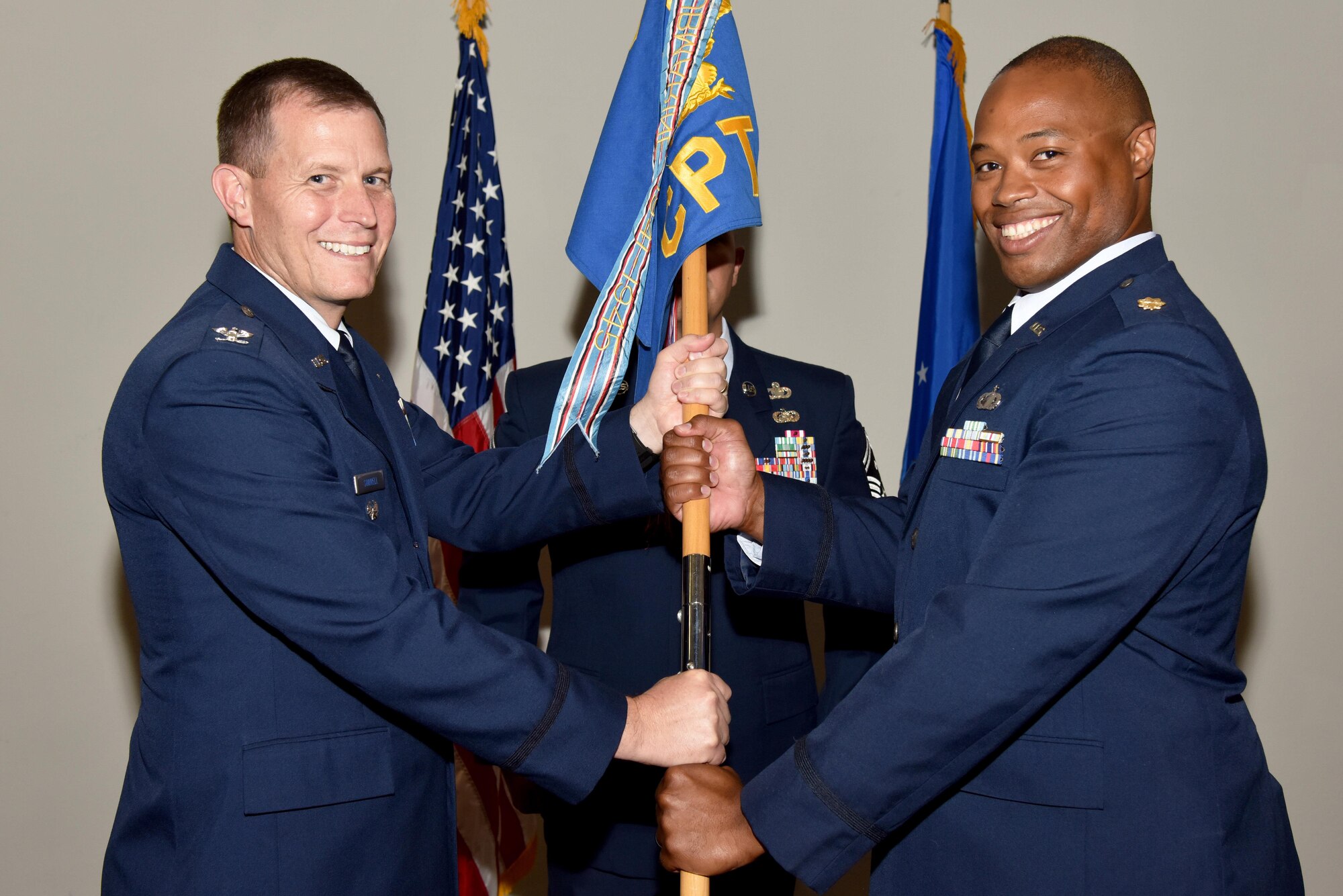 U.S. Air Force Maj. Nelson Mitchell, the new 17th Comptroller Squadron Commander, takes the guideon from Col. Jeffery Sorrell, 17th Training Wing Vice Commander, during the 17th CPTS Change of Command ceremony at the Event Center on Goodfellow Air Force Base, Texas, June 2, 2017. Mitchell previously served as the Air Force Installation and Mission Support Center deputy of budget operations at Joint-Base San Antonio. (U.S. Air Force photo by Staff Sgt. Joshua Edwards/Released)