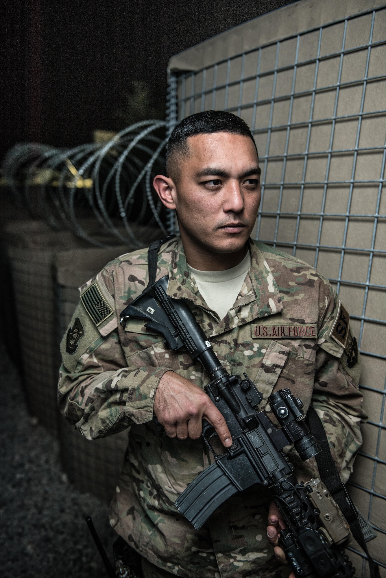 U.S. Air National Guard Staff Sgt. Ricky Meno, a vehicle search area lead with the 407th Expeditionary Security Forces Squadron, stands with his M4 carbine for a photo May 10, 2017, at the 407th Air Expeditionary Group. Meno's team ensures only authorized personnel and vehicles enter the installation by providing vehicles search and additional overwatch via towers, cameras and other sensors covering the area. Meno, a traditional guardsman with the 254th Security Forces Squadron at Andersen Air Force Base, Guam, deployed in support of Operation Inherent Resolve. (U.S. Air Force photo by Staff Sgt. Alexander W. Riedel)