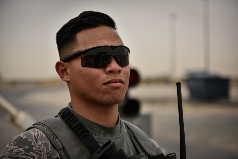 U.S. Air National Guard Airman 1st Class Randall Diego, a security forces member with the 407th Expeditionary Security Forces Squadron, provides overwatch at a vehicle search area May 13, 2017, in Southwest Asia. Randall is a member of the 254th Security Forces Squadron at Andersen Air Force Base and volunteered for his first deployment right out of technical training. He is part of a team of Guam service members who deployed to the 407th AEG in support of Operation Inherent Resolve. (U.S. Air Force photo by Staff Sgt. Alexander W. Riedel)
