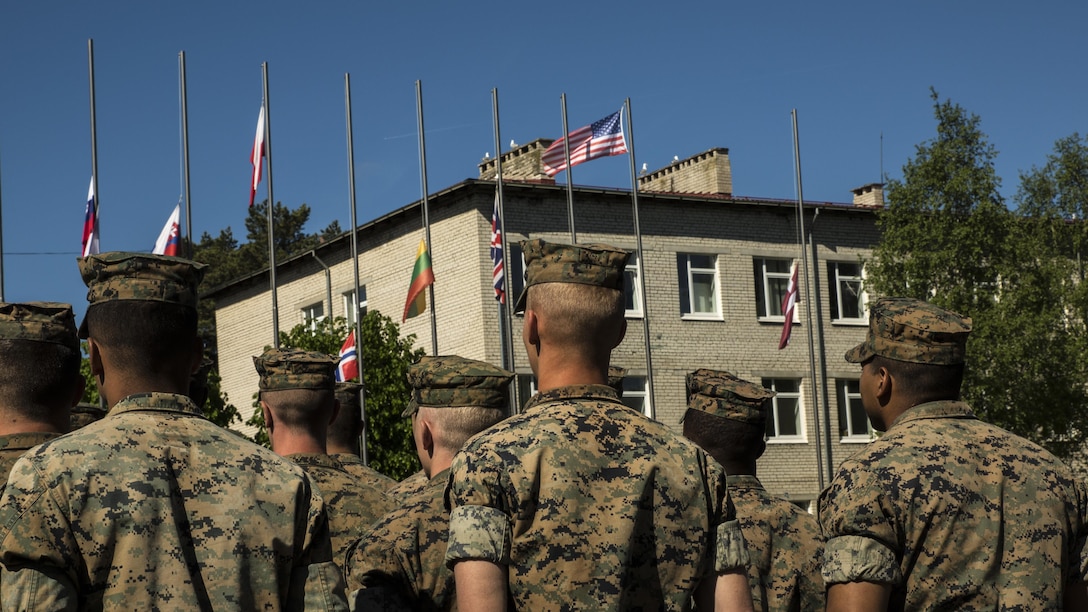 ADAZI, Latvia-Marines with the Black Sea Rotational Force 17.1 stand in formation as the flags of some of the participating nations are raised to the Latvian National Anthem during the opening ceremony of Exercise Saber Strike 17 at Camp Adazi, Latvia, June 3, 2017.  The combined training prepares NATO Allies and partners to respond more to regional crises and meet their own security needs by improving the security of borders and countering threats. (U.S. Marine Corps photo by Cpl. Devan Alonzo Barnett/Released)