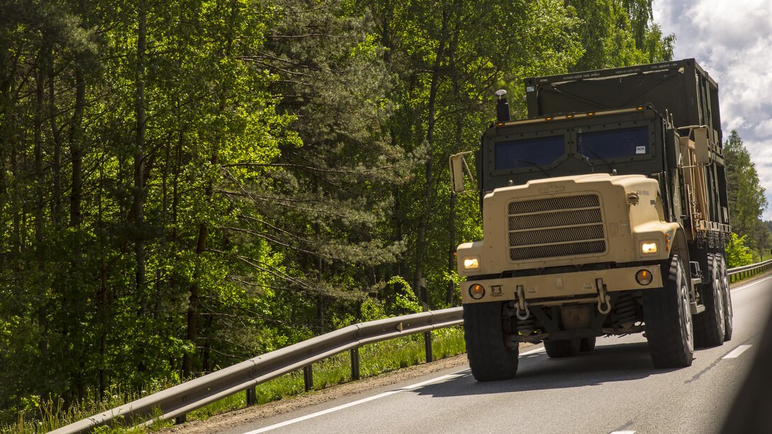 SALASPILS, Latvia-Marines with Combat Logistics Battalion 25, 4th Marine Logistics Group, Marine Forces Reserve, transport equipment and personnel by convoy from Ventspils to Adazi, Latvia, during Exercise Saber Strike 17, June 2, 2017.  Exercise Saber Strike 17 is an annual combined-joint exercise conducted at various locations throughout the Baltic region and Poland. The combined training prepares NATO Allies and partners to effectively respond to regional crises and to meet their own security needs by strengthening their borders and countering threats. (U.S. Marine Corps photo by Cpl. Devan Alonzo Barnett/Released)