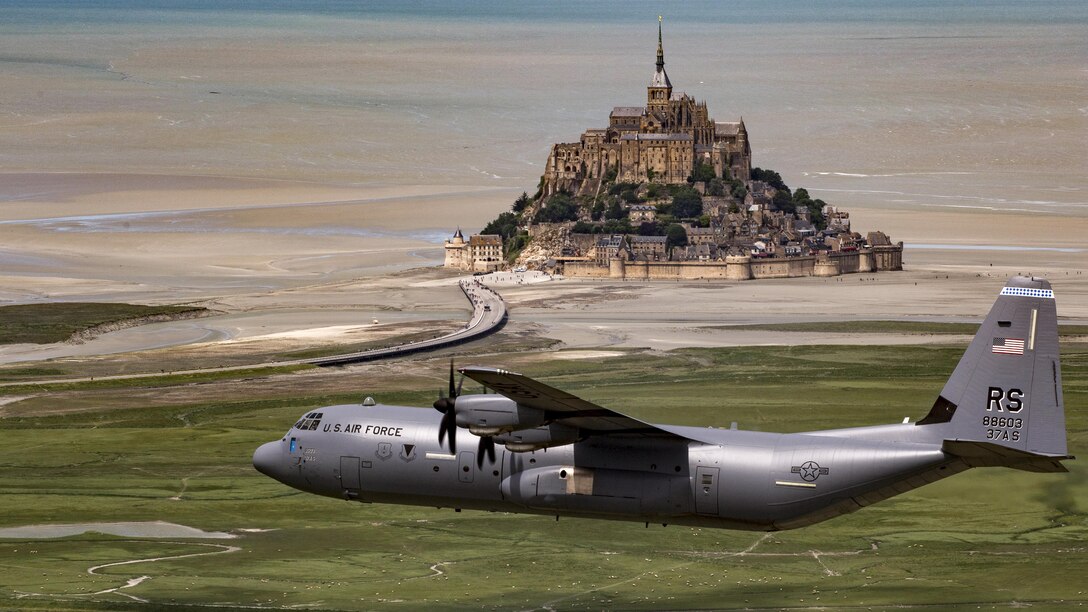 Air Force Brig. Gen. Richard G. Moore Jr. flies a C-130J Super Hercules past Mont Saint-Michel in Normandy, France, June 3, 2017, during an event commemorating the 73rd anniversary of D-Day. Moore is commander of the 86th Airlift Wing. Air Force photo by Senior Airman Devin Boyer