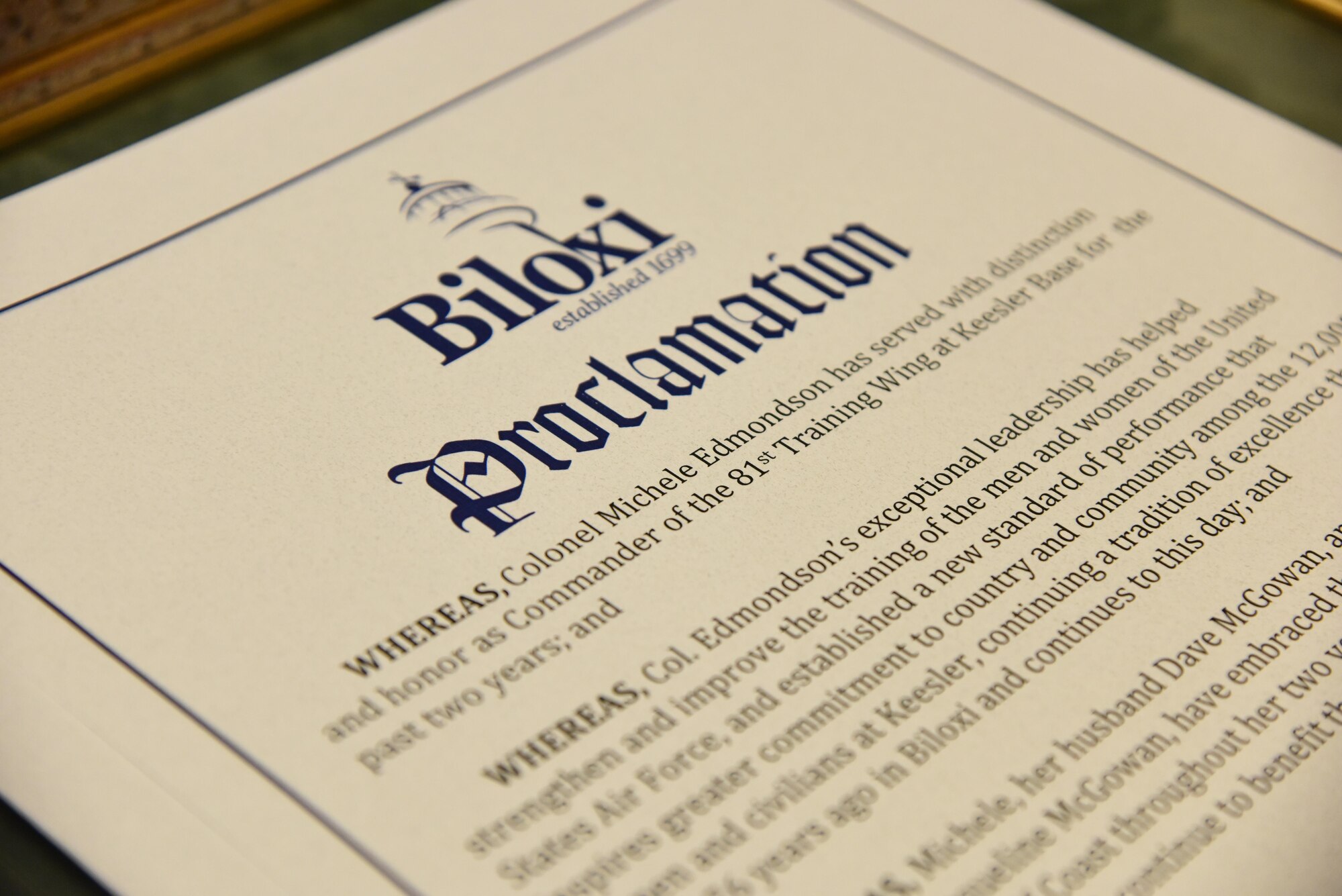 A “Col. Michele Edmondson Day” proclamation sits on display at Biloxi City Hall during a recognition ceremony for Col. Michele Edmondson, 81st Training Wing commander, May 30, 2017, in Biloxi, Miss. The Biloxi Mayor Andrew “FoFo” Gilich hosted the ceremony, during a Biloxi city council meeting, to recognize Edmondson and her family for their support to the city during her assignment at Keesler. (U.S. Air Force photo by Kemberly Groue)
