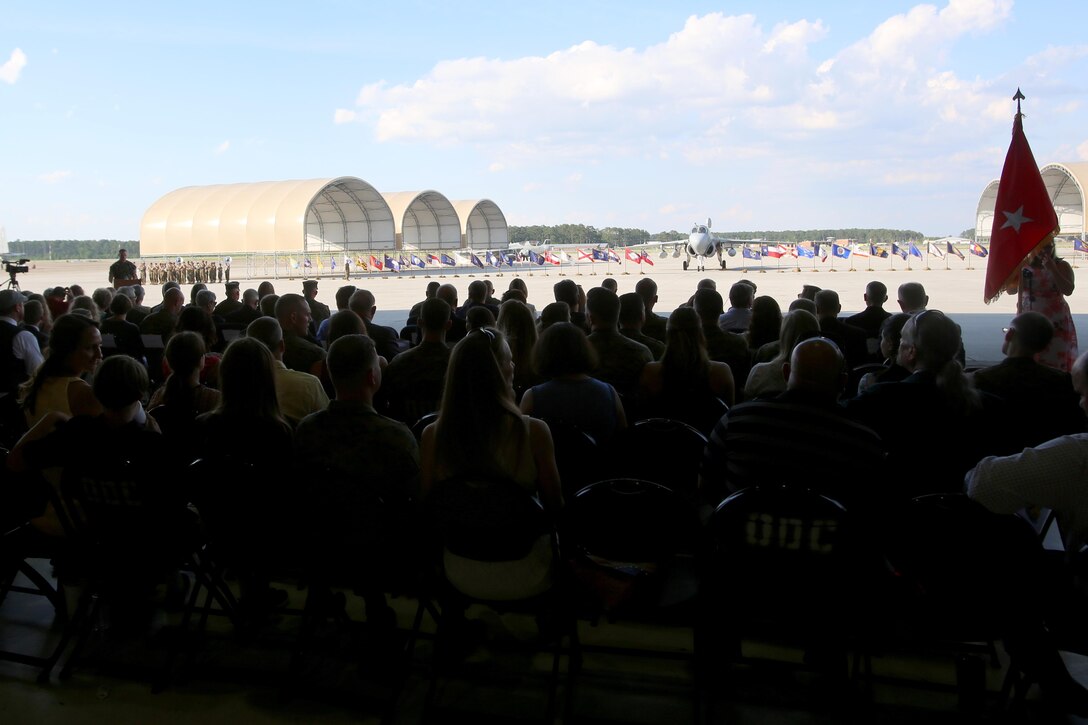 A crowd of Marines and family members gather during Marine Tactical Electronic Warfare Squadron 4’s deactivation ceremony at Marine Corps Air Station Cherry Point, N.C., June 2, 2017. VMAQ-4, Marine Aircraft Group 14, 2nd Marine Aircraft Wing, has officially completed their sundown after 35 years of supporting operations around the world. (U.S. Marine Corps photo by Cpl. Jason Jimenez/ Released)