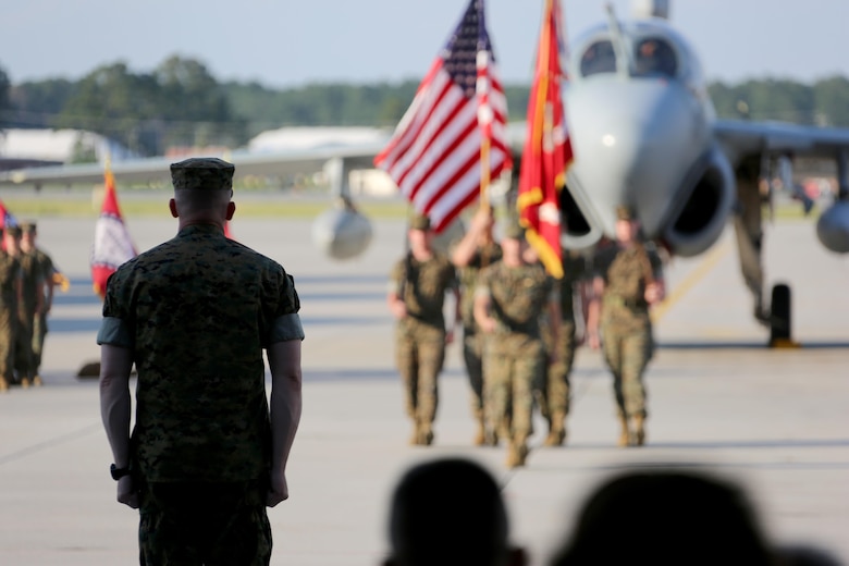 Lt. Col. Paul K. Johnson III awaits the squadron’s color guard during Marine Tactical Electronic Warfare Squadron 4’s deactivation ceremony at Marine Corps Air Station Cherry Point, N.C.,  June 2, 2017. “This is a tough assignment to say goodbye to something so special,” said retired Col. James Anderst, VMAQ-4, Marine Aircraft Group 14, 2nd Marine Aircraft Wing’s first commanding officer. Johnson was the last commanding officer of VMAQ-4. (U.S. Marine Corps photo by Cpl. Jason Jimenez/ Released)