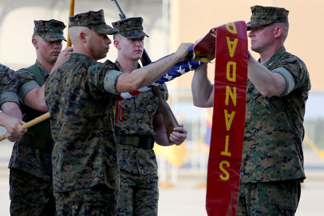Sgt. Maj Alex Narvaez, left, and Lt. Col. Paul K. Johnson III case the squadron colors during Marine Tactical Electronic Warfare Squadron 4’s deactivation ceremony at Marine Corps Air Station Cherry Point, N.C., June 2, 2017. “We have finished at the top of our game,” said Johnson, the last commanding officer of VMAQ-4, Marine Aircraft Group 14, 2nd Marine Aircraft Wing. Narvaez was the sergeant major of VMAQ-4. (U.S. Marine Corps photo by Cpl. Jason Jimenez/ Released)