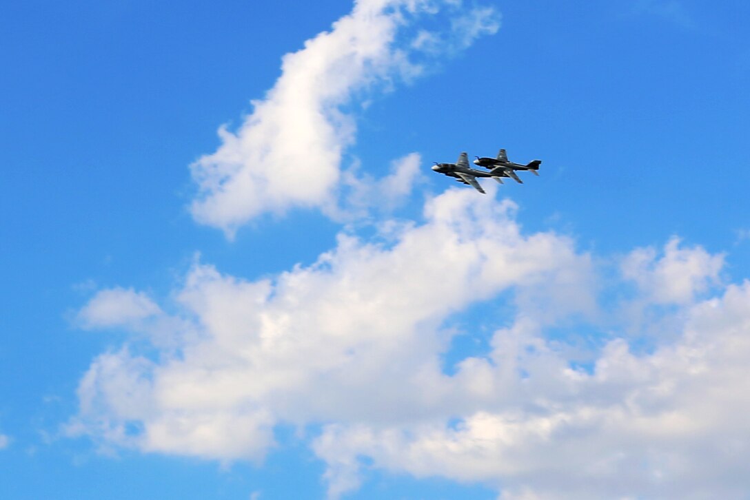 Two EA-6B Prowlers soar over Marine Tactical Electronic Warfare Squadron 4’s deactivation ceremony at Marine Corps Air Station Cherry Point, N.C., June 2, 2017. Tracing their lineage back to Marine Composite Reconnaissance Squadron One in the 1950’s, VMAQ-4, Marine Aircraft Group 14, 2nd Marine Aircraft Wing, was officially commissioned on Nov. 7, 1981. Back then, the Seahawks flew the EA-6A Electric Intruder until the transitioning to the EA-6B Prowler in the 1990’s. (U.S. Marine Corps photo by Cpl. Jason Jimenez/ Released)