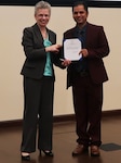 DLA Distribution deputy commander, Twila C. Gonzales, Senior Executive Service presents keynote speaker, Tika Ram Dhungana with an SES note in appreciation for his participation in DLA Distribution’s Multicultural Committee Asian Americans and Pacific Islanders event held on Wednesday, May 23.