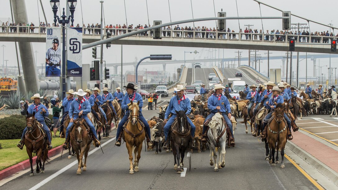 Marine Corps Brig. Gen. Kevin J. Killea, commanding general of Marine Corps Installations West-Marine Corps Base Camp Pendleton, participates in a cattle drive with San Diego County Fair personnel in San Diego’s Gaslamp Quarter, June 3, 2017. The cattle drive commemorated the district's 150th anniversary and promoted the fair. Marine Corps photo by Lance Cpl. Brooke Woods