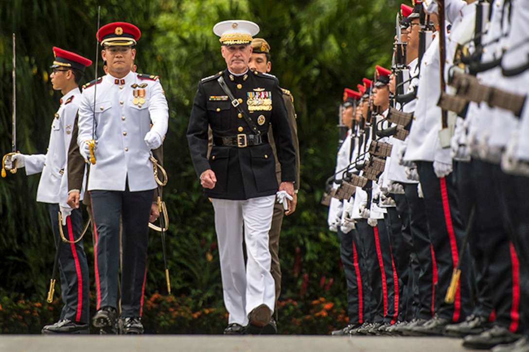 Marine Corps Gen. Joe Dunford, chairman of the Joint Chiefs of Staff, inspects an honor guard in Singapore, June 2, 2017. Dunford is in Singapore to attend the Shangri-La Dialogue, an Asia-focused defense summit, where he will meet with regional allies and counterparts to discuss common security issues. DoD photo by Navy Petty Officer 2nd Class Dominique A. Pineiro